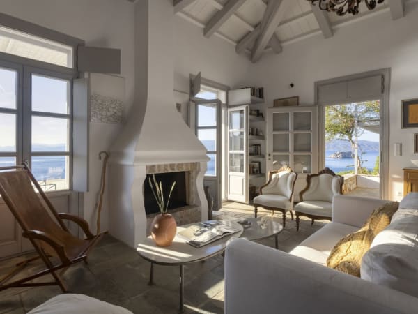 The luminous open-concept communal area on the top floor looks out to sea via a pair of French doors.